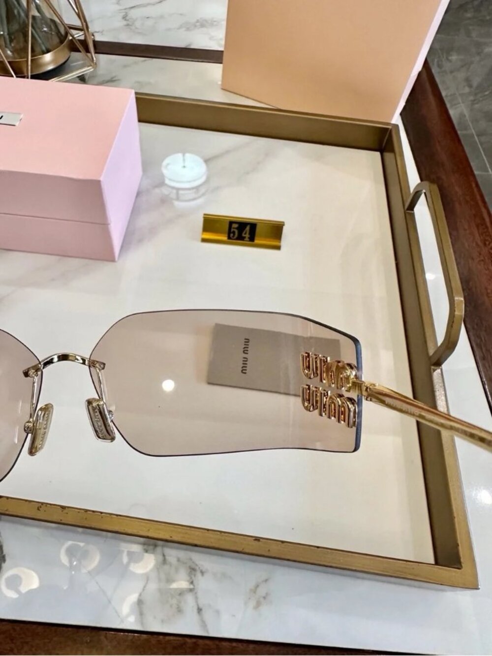 Miu Miu Rimless Sunglasses with Pink-Brown Lenses and Gold Accents - Picture 3 of 7